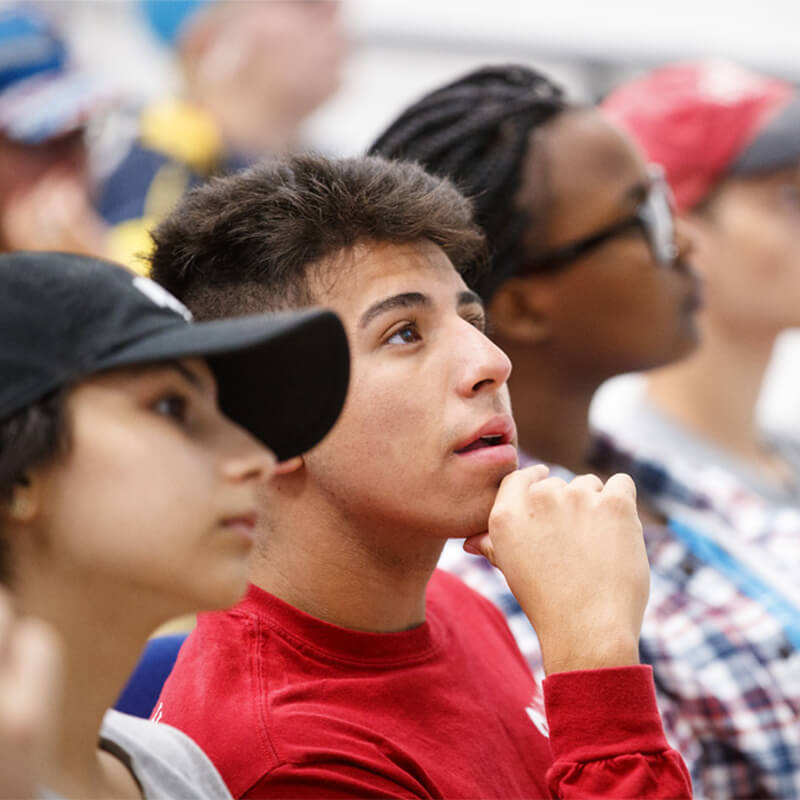 Student in classroom looking at professor